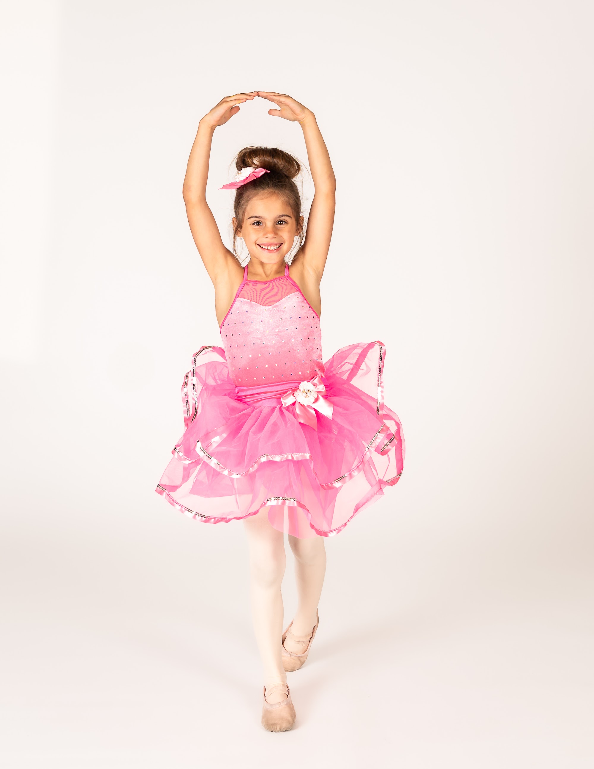 Dancer in a pink ombre tutu on releve