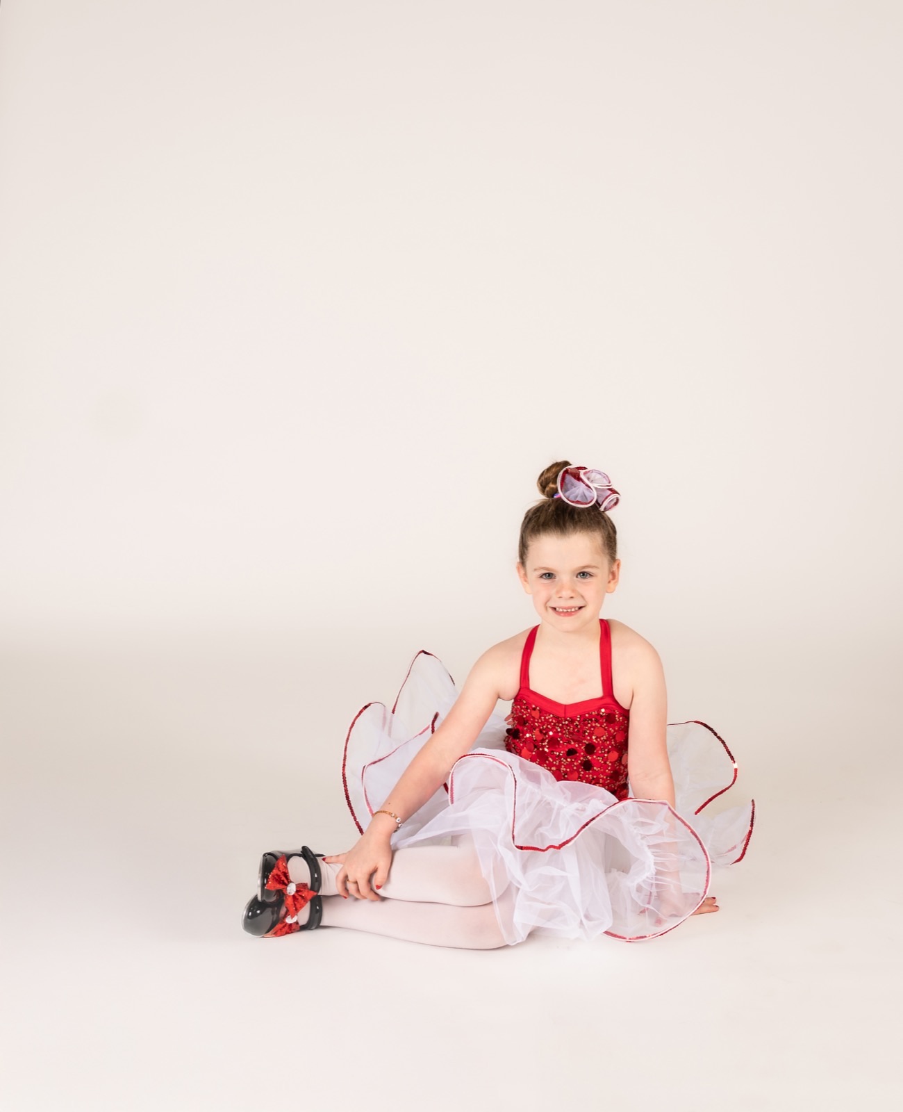 Five and six year old dancer posing in ballet and tap class attire