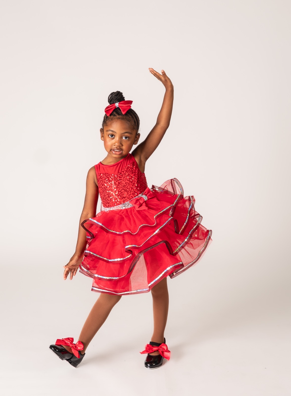 Five and six year old dancer smiling in ballet and tap attire